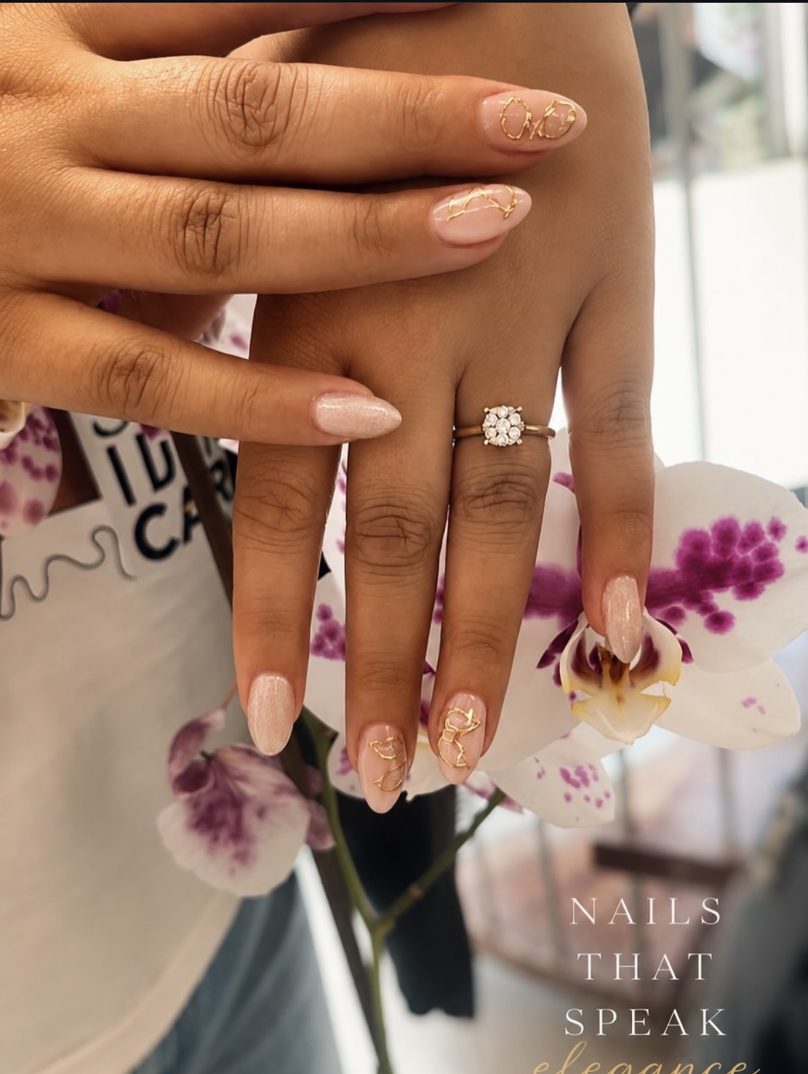 Nude gel nails with gold nail art