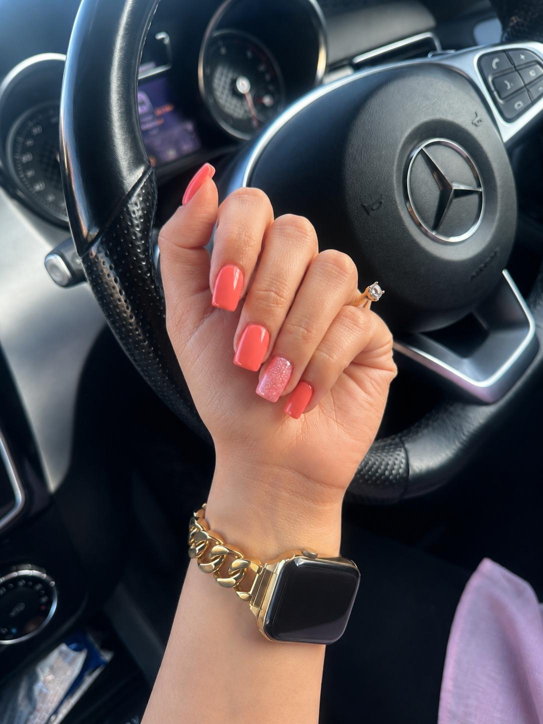 Coral gel manicure with glitter accent nail